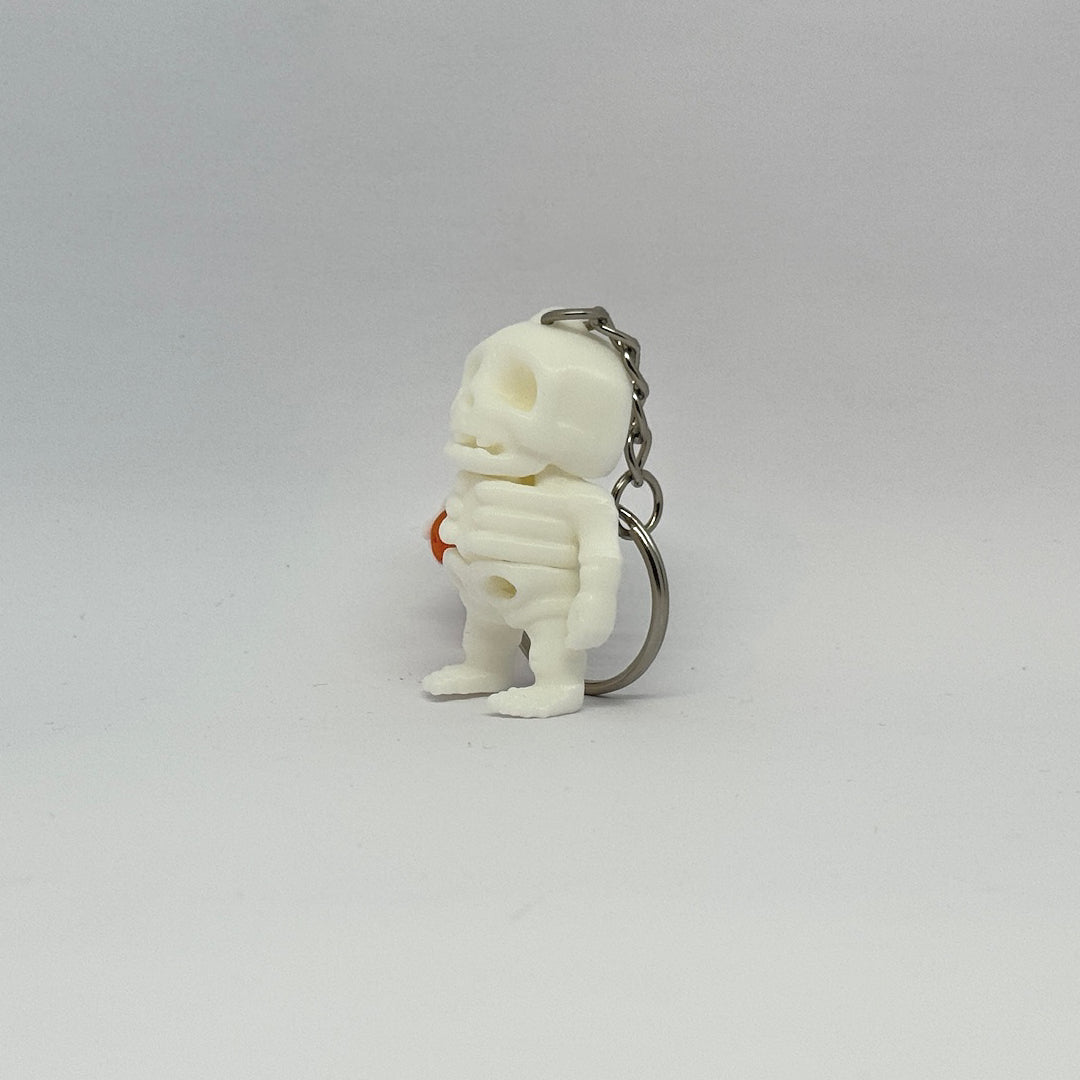 Mini-Skelett mit Kürbis