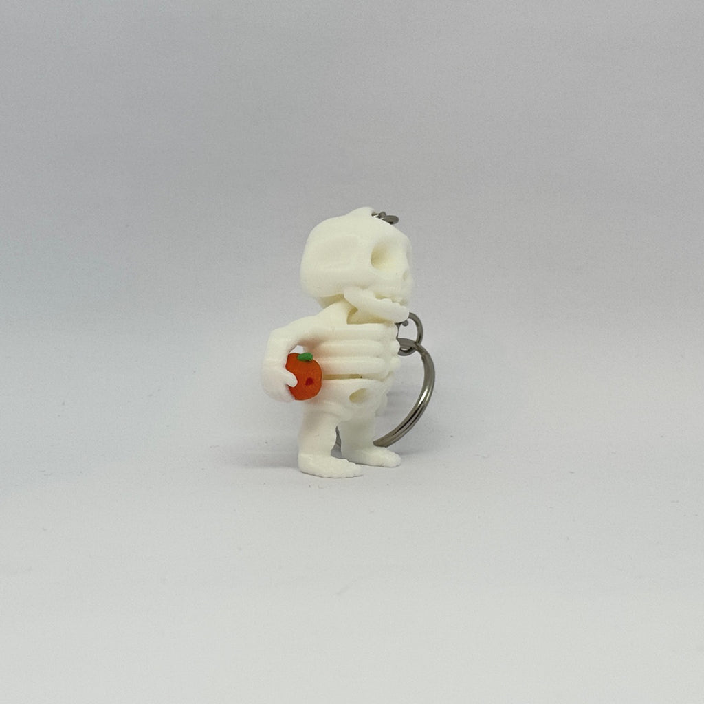 Mini-Skelett mit Kürbis