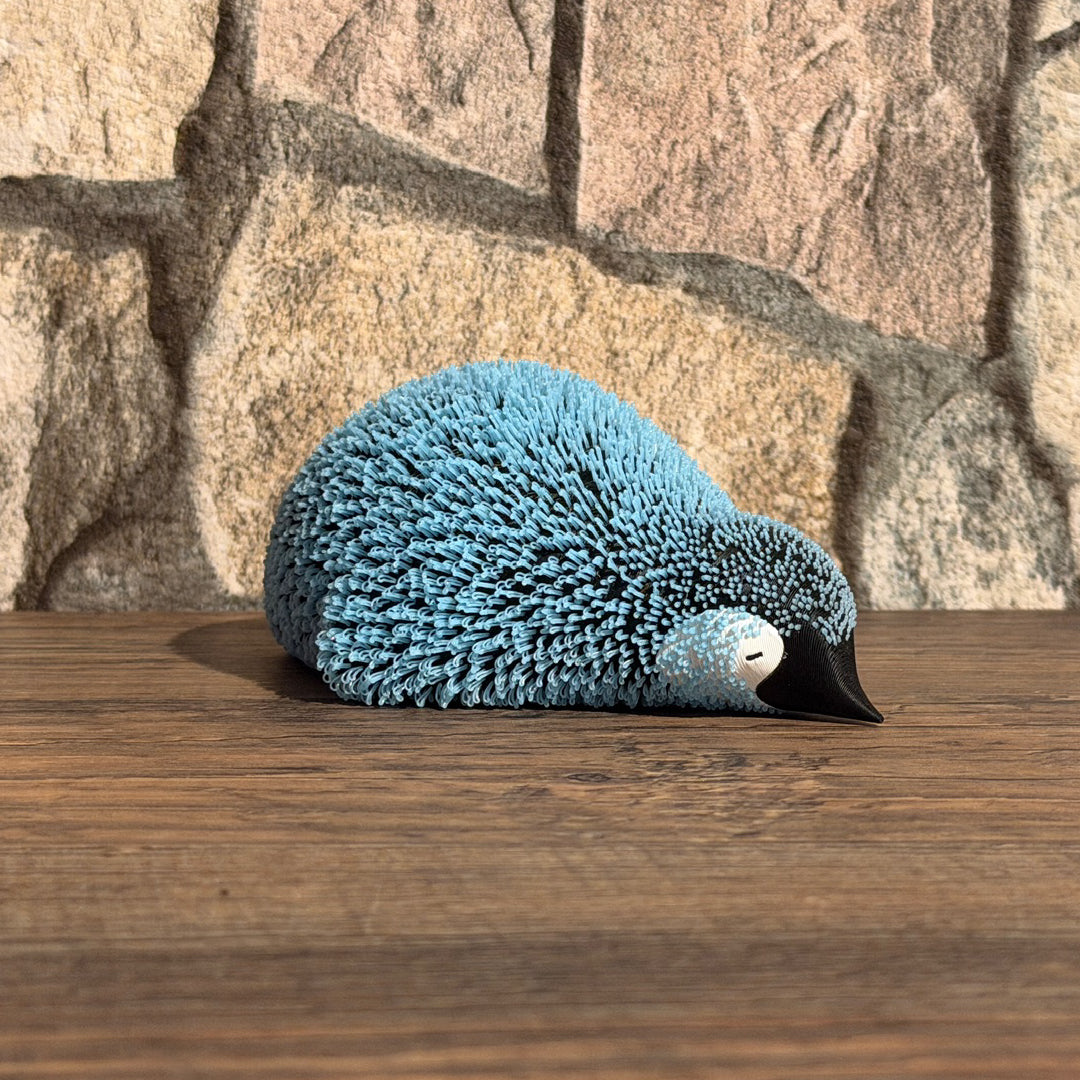 Flauschiger Pinguin Liegend